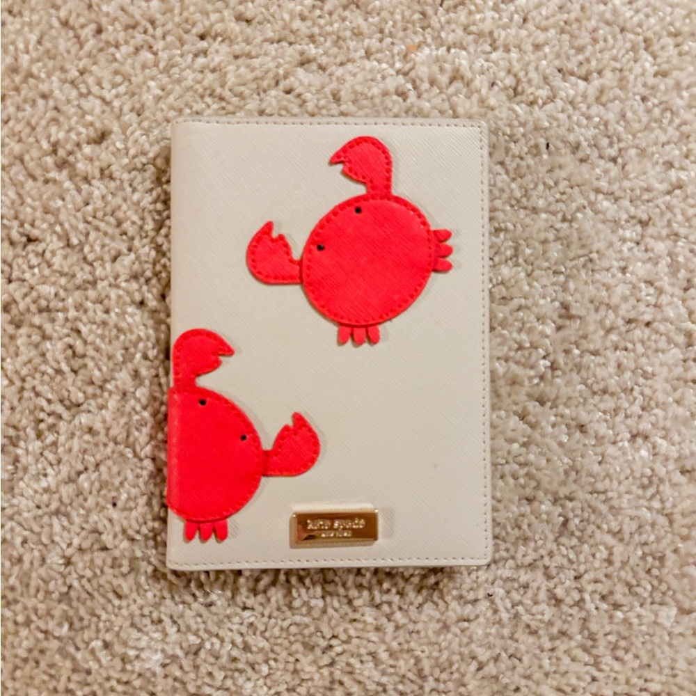 Kate Spade Beige Passport Holder with Red Crabs